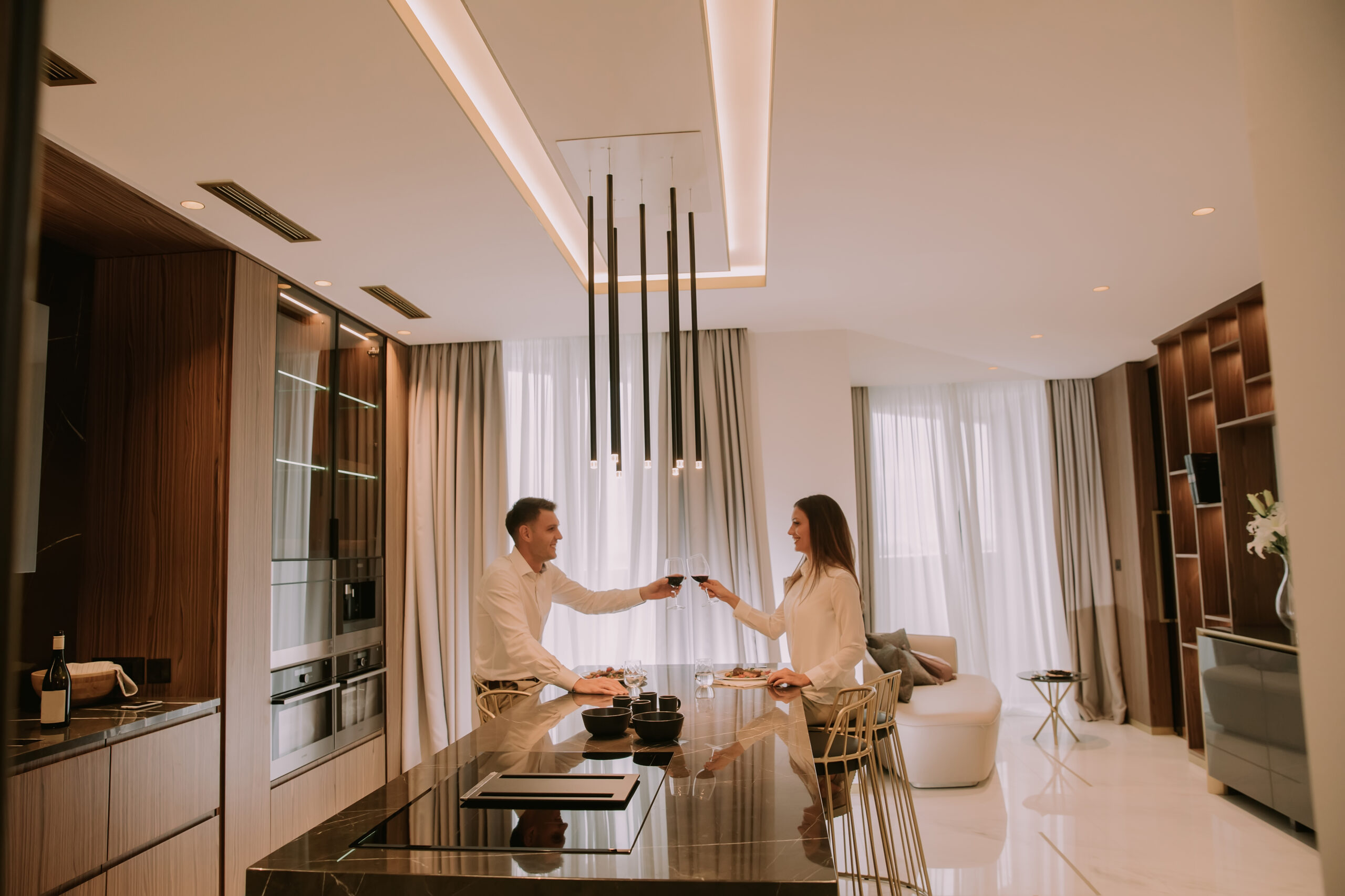 Sweet couple having a romantic dinner at luxury kitchen Kitchen